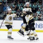 The Bruins celebrate Jake DeBrusk's third period goal.