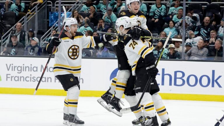 The Bruins celebrate Jake DeBrusk's third period goal.