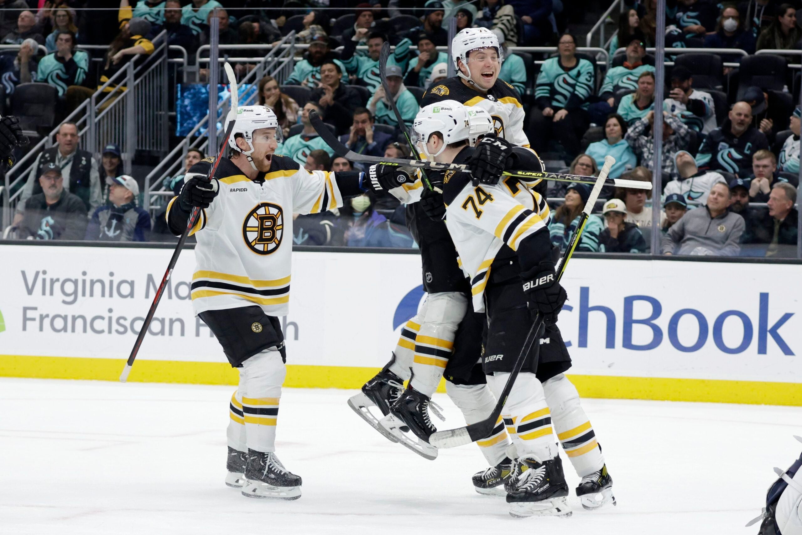 The Bruins celebrate Jake DeBrusk's third period goal.
