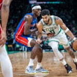 Jayson Tatum drives for the basket past Detroit Pistons center Jalen Duren.