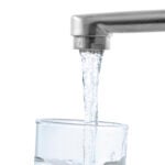 Water flows into a glass