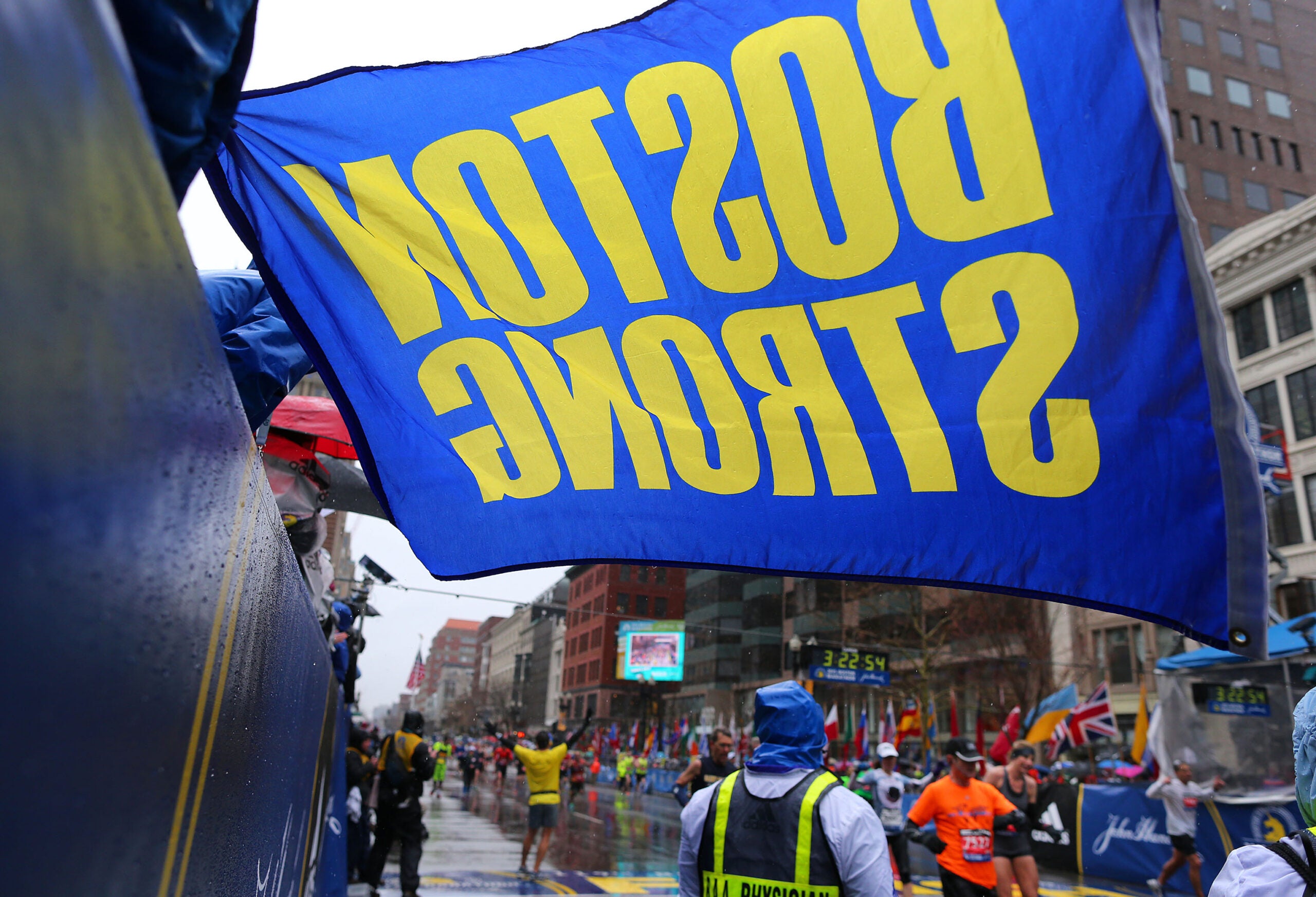 A Boston Strong flag held by Carlos Arredondo at the finish line of the 2015 Boston Marathon.