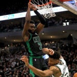 Boston Celtics guard Jaylen Brown (7) goes for a monster flush in the face of Milwaukee Bucks forward Giannis Antetokounmpo (34) during the fourth quarter. The Milwaukee Bucks host the Boston Celtics in Game 1 of the Eastern Conference NBA Semi-Finals at Fiserv Forum.