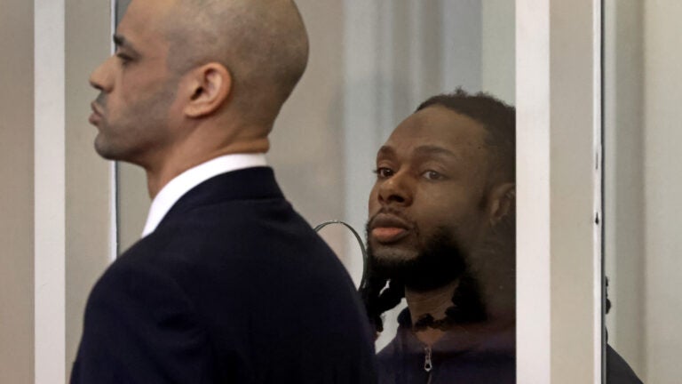 Csean Skerritt, 34, was arraigned in Dorchester Municipal Court Friday on murder and weapons charges stemming from the fatal shooting of 13-year-old Tyler Lawrence. He's shown standing in court with his attorney on the left.