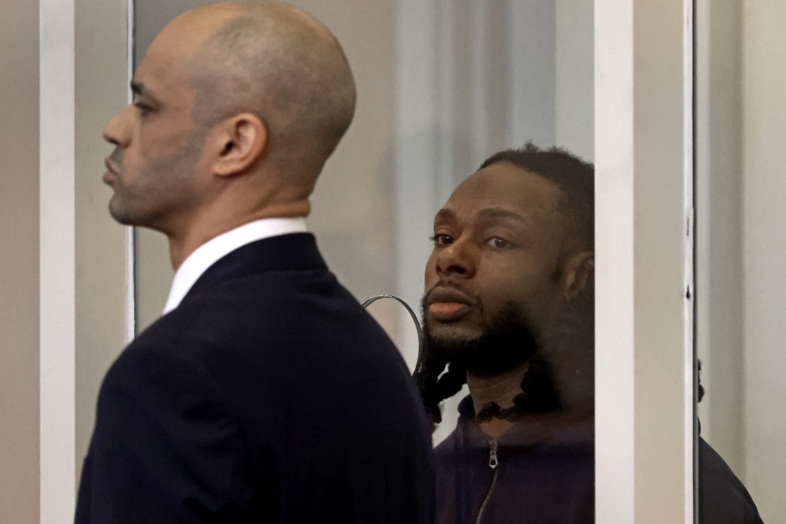 Csean Skerritt, 34, was arraigned in Dorchester Municipal Court Friday on murder and weapons charges stemming from the fatal shooting of 13-year-old Tyler Lawrence. He's shown standing in court with his attorney on the left.