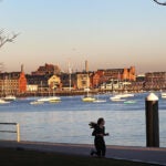 People running in Boston's Seaport District.