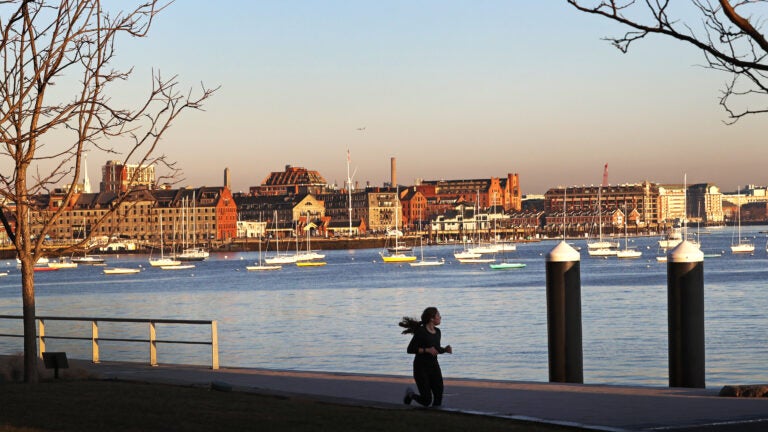 People running in Boston's Seaport District.