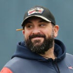 Foxborough 01/04/2023 Then New England Patriots held practice on their practice field at Gillette Stadium. Matt Patricia smiles during warmups.