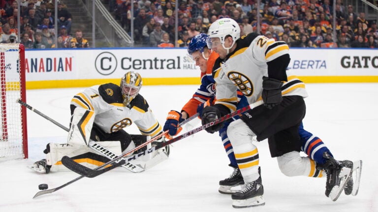 Jeremy Swayman and Garnet Hathaway stopping an Oilers attack for the Bruins.