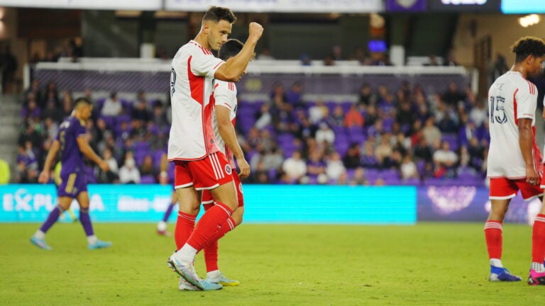 Giacomo Vrioni pumps his fist after scoring a goal for the revolution