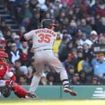 Adley Rutschman #35 of the Baltimore Orioles bats during the fifth inning against the Boston Red Sox on Opening Day at Fenway Park