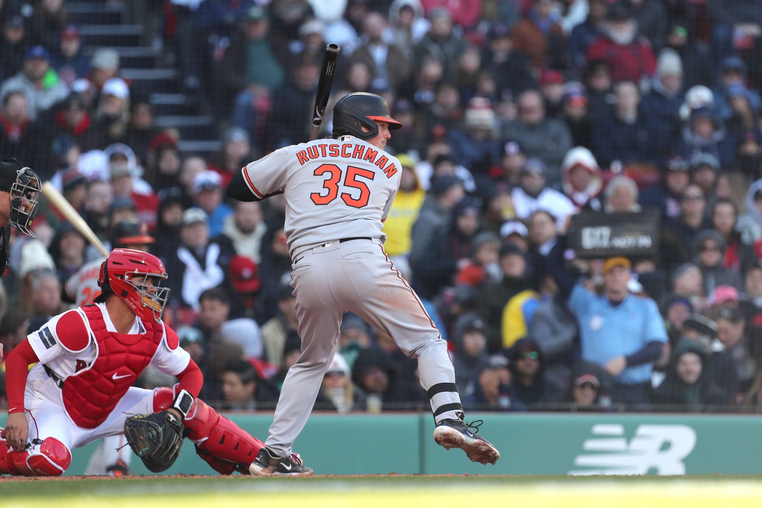 Adley Rutschman #35 of the Baltimore Orioles bats during the fifth inning against the Boston Red Sox on Opening Day at Fenway Park