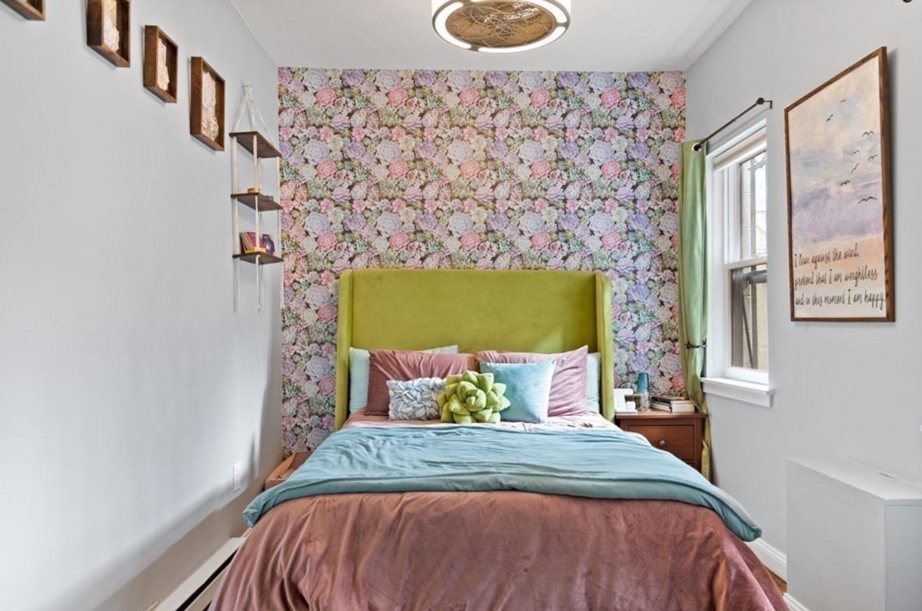 Each bedroom is made unique with floral wallpaper for a bold interior design choice.