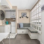 This daybed under a picture window is the perfect place to curl up with a book or cup of coffee.