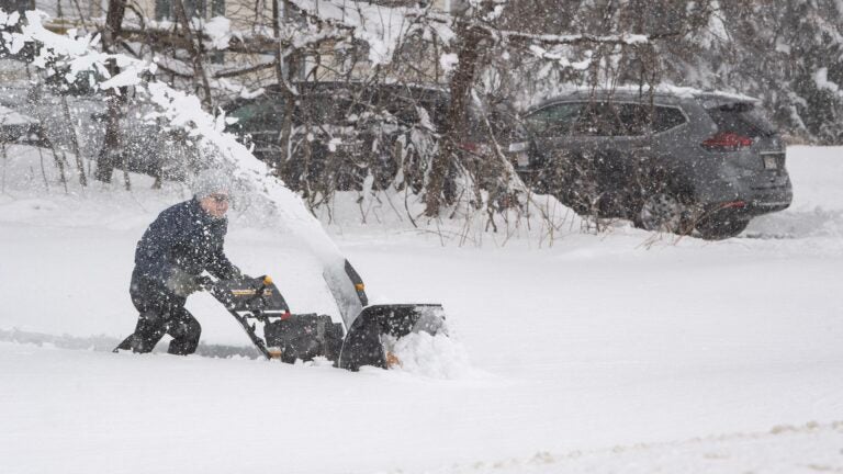 A person uses a snowblower in Rutland, Massachusetts, on Tuesday.