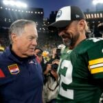 Head coach Bill Belichick of the New England Patriots and Aaron Rodgers #12 of the Green Bay Packers talk after Green Bay's 27-24 win in overtime at Lambeau Field on October 02, 2022 in Green Bay, Wisconsin.