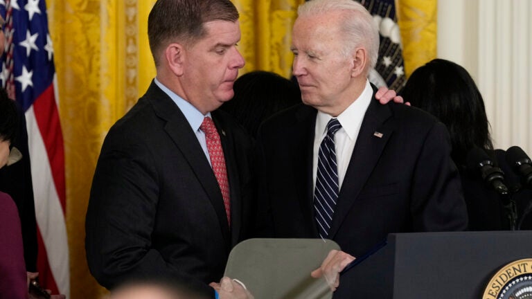 President Joe Biden shakes hands with outgoing Secretary of Labor Marty Walsh, during a ceremony announcing his nomination of Julie Su to serve as the new secretary of labor, in the East Room of the White House, Wednesday, March 1, 2023.