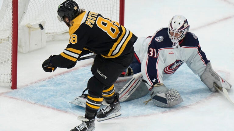 The Bruins David Pastrnak scores the winning goal