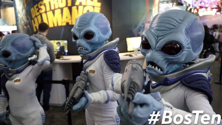 People cosplay as "Crypto," the main character in the video game "Destroy All Humans!," at PAX East 2020 in Boston.