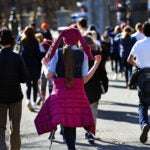 A student walks back to class after recess at the Boston Common