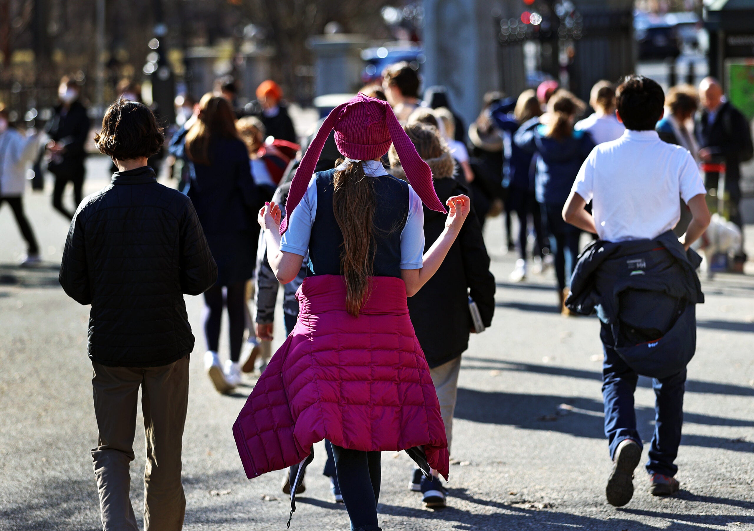 A student walks back to class after recess at the Boston Common