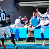 Denver Broncos punter Corliss Waitman (17) punts during an NFL football game against the Carolina Panthers Sunday, Nov. 27, 2022, in Charlotte, N.C.