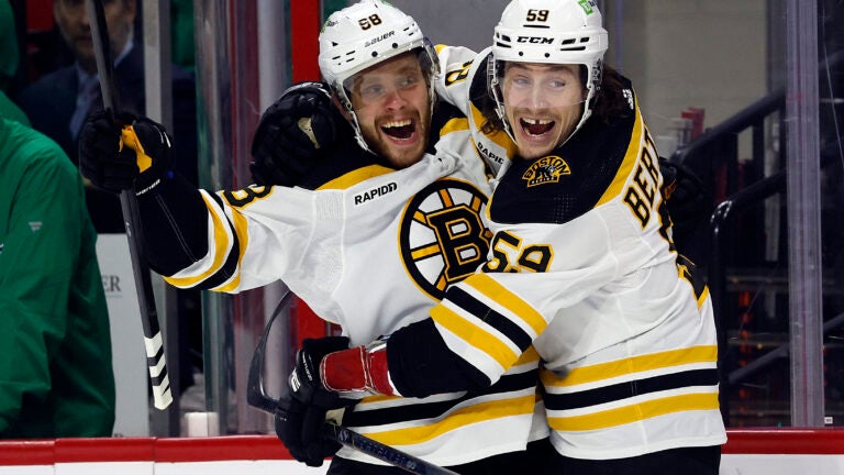 The Bruins David Pastrnak celebrates after his goal with teammate Tyler Bertuzzi.