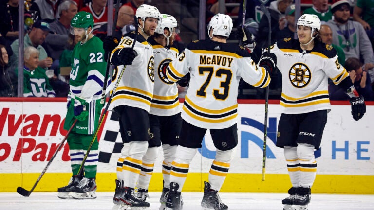 Carolina Hurricanes players celebrate after defeating the