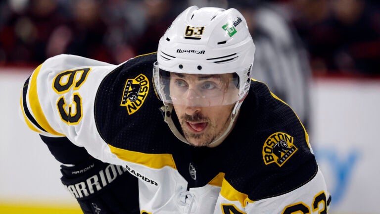 Boston Bruins' Brad Marchand (63) waits for a face-off against the Carolina Hurricanes during the third period of an NHL hockey game in Raleigh, N.C., Sunday, Jan. 29, 2023.