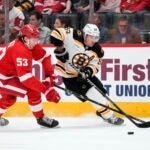 The Bruins' Brad Marchand and Detroit's Moritz Seider, Bruins vs Blackhawks prediction