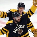 Boston Bruins' Nick Foligno (17) celebrates after his goal with Taylor Hall (71) during the second period of an NHL hockey game against the Washington Capitals, Saturday, Feb. 11, 2023, in Boston.