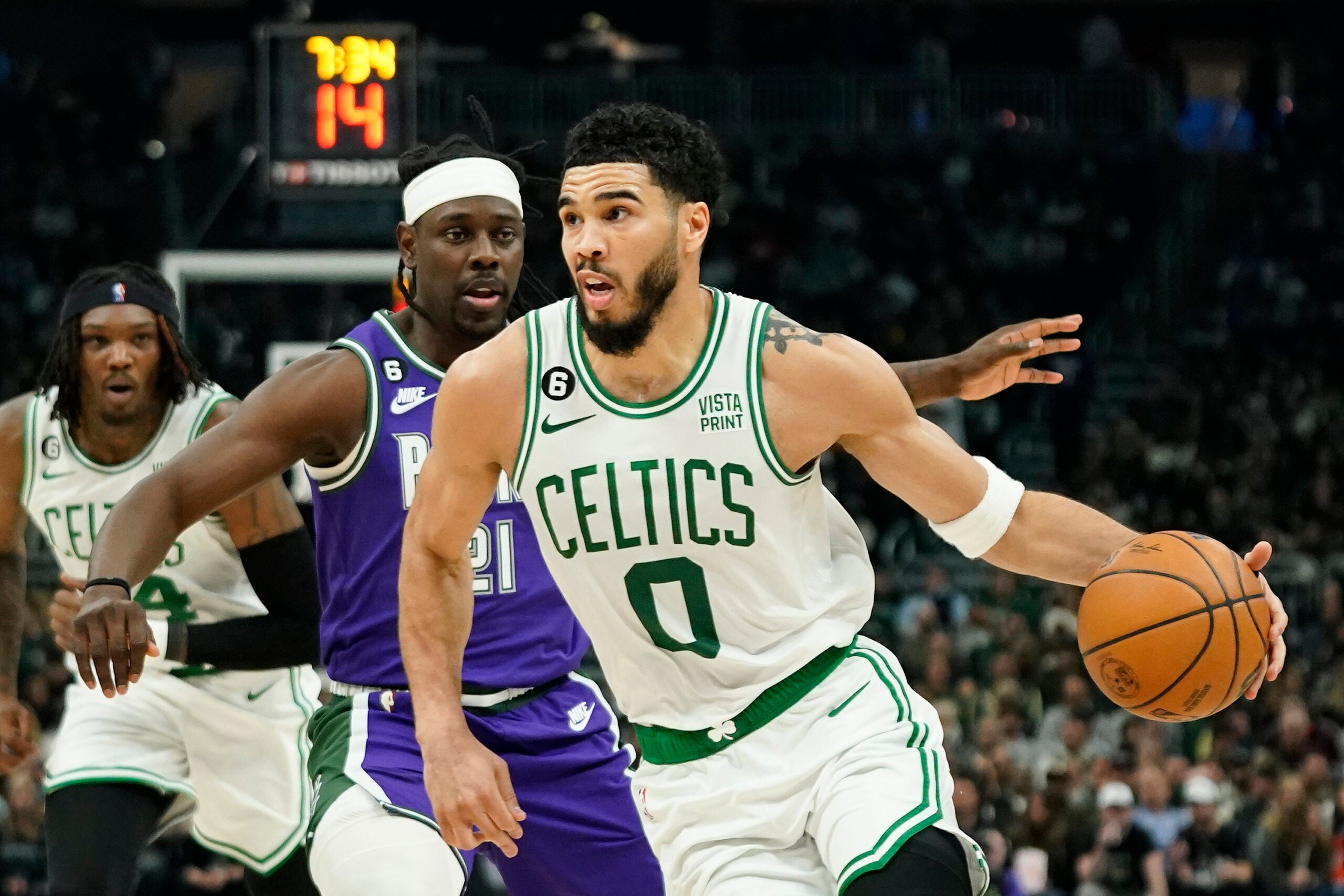 The Celtics Jayson Tatum drives to the basket.