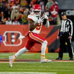 Kansas City Chiefs wide receiver JuJu Smith-Schuster (9) runs after a catch against the Cincinnati Bengals in the first half of an NFL football game in Cincinnati, Sunday, Dec. 4, 2022.