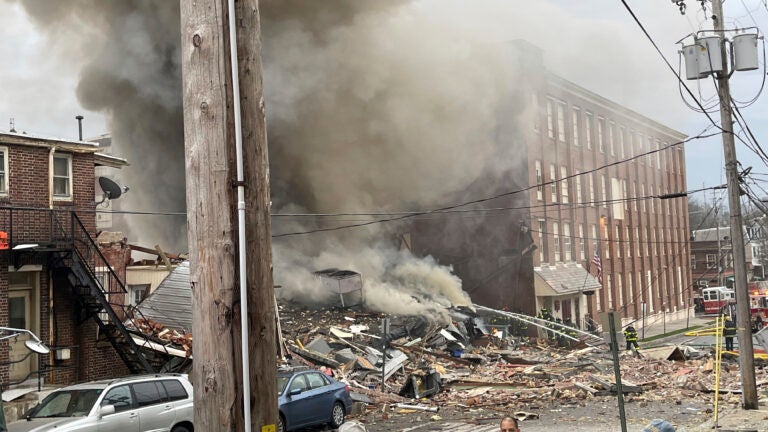 Emergency personnel work at the site of the deadly explosion in West Reading, Pennsylvania, on Friday.