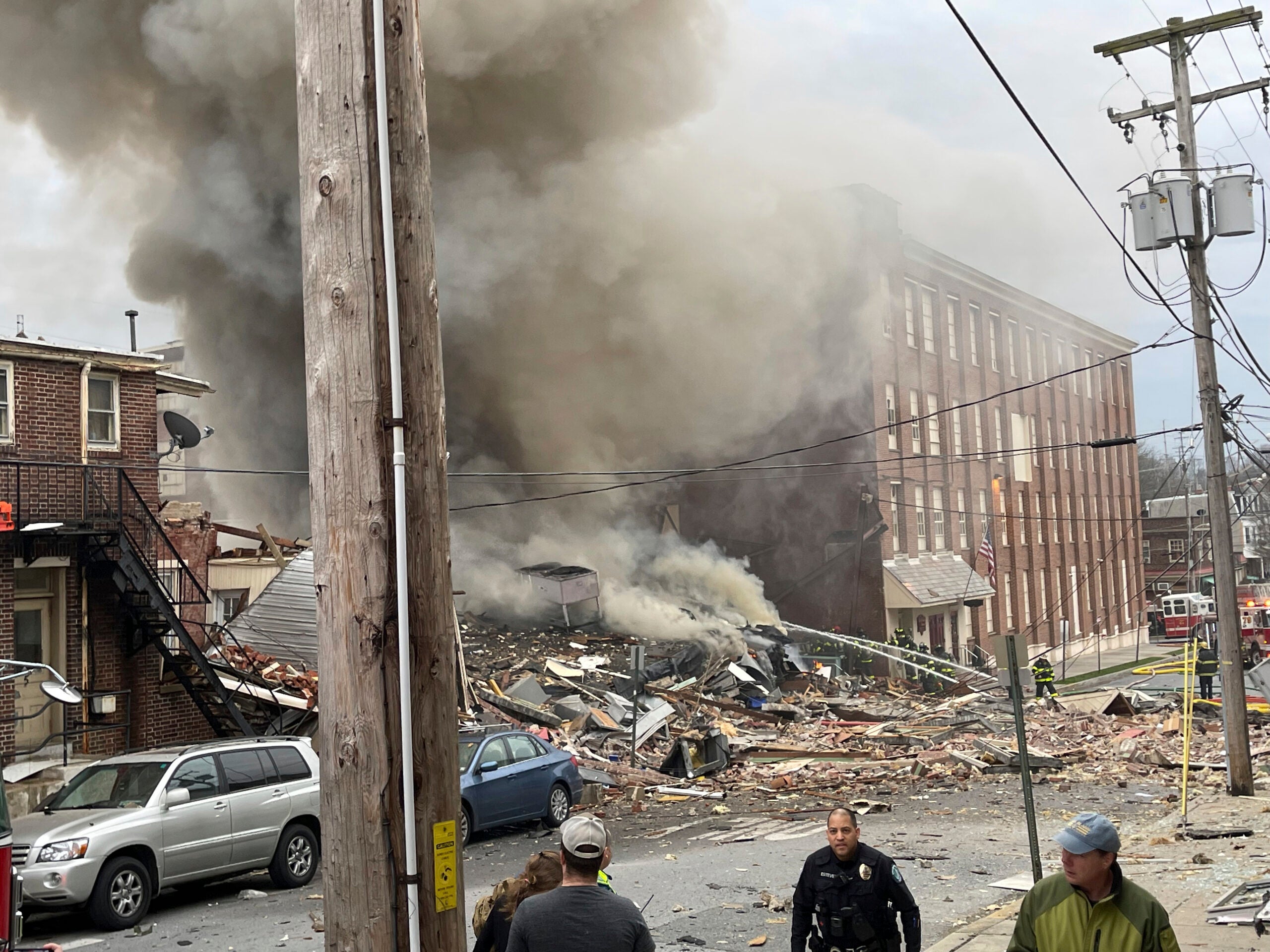 Emergency personnel work at the site of the deadly explosion in West Reading, Pennsylvania, on Friday.