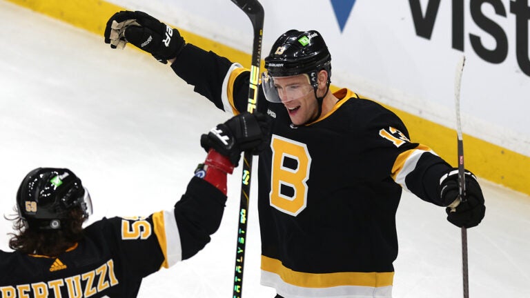 Boston Bruins center Charlie Coyle (13) (right) celebrates his 1st period goal with Tyler Bertuzzi.