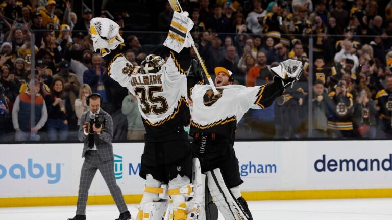 Boston Bruins goaltender Linus Ullmark celebrates with goaltender Jeremy Swayman after an NHL hockey game against the Colorado Avalanche Saturday, Dec. 3, 2022, in Boston.