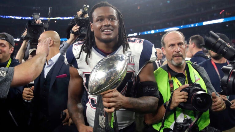 New England Patriots' Dont'a Hightower holds the Vince Lombardi Trophy after the NFL Super Bowl 51 football game against the Atlanta Falcons Sunday, Feb. 5, 2017, in Houston. The Patriots won 34-28.