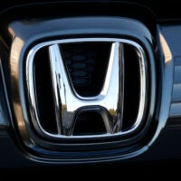 The logo of Honda Motor Co. is seen on a Honda vehicle.