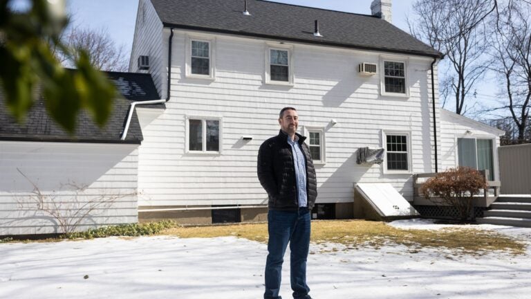 Josh Stein posed for a portrait outside his home in Newton, which he bought with his wife in 2019.