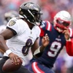 Quarterback Lamar Jackson #8 of the Baltimore Ravens attempts a pass during the first half at Gillette Stadium on September 25, 2022 in Foxborough, Massachusetts.