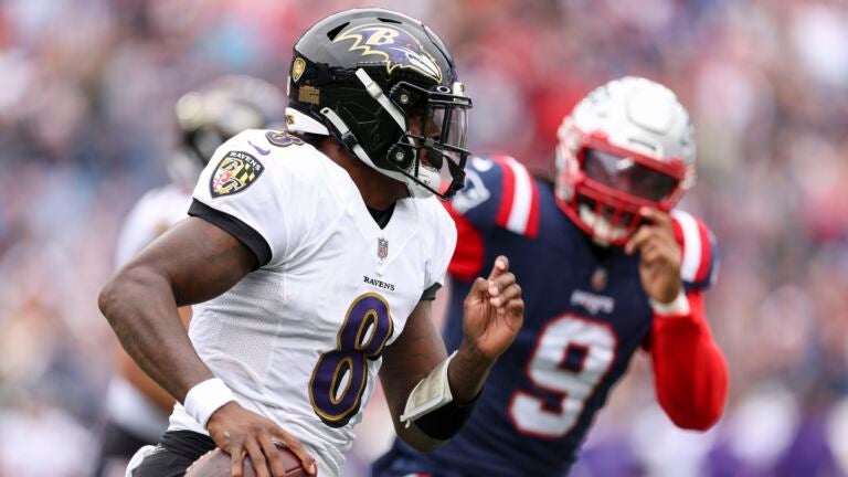 Quarterback Lamar Jackson #8 of the Baltimore Ravens attempts a pass during the first half at Gillette Stadium on September 25, 2022 in Foxborough, Massachusetts.