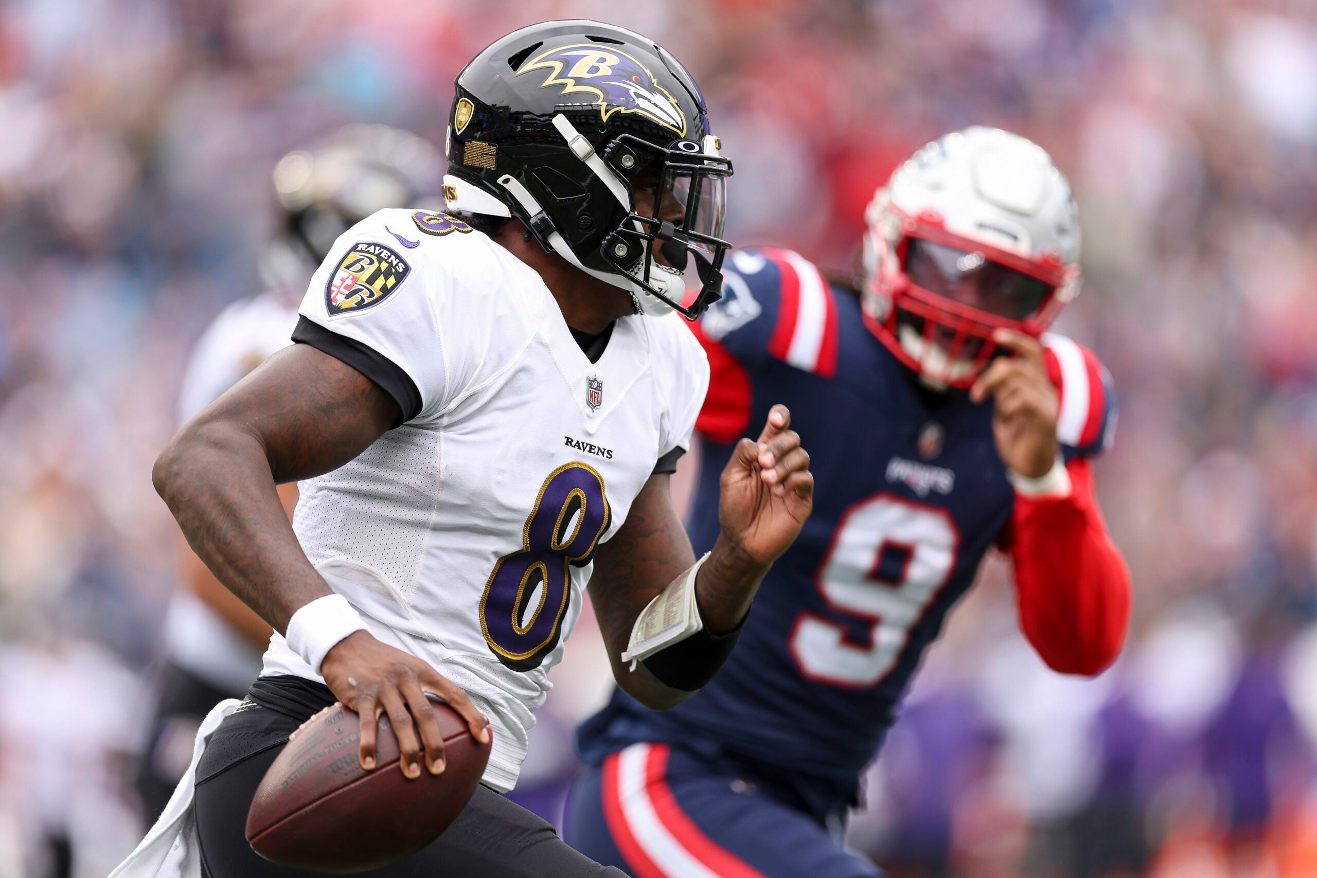 Quarterback Lamar Jackson #8 of the Baltimore Ravens attempts a pass during the first half at Gillette Stadium on September 25, 2022 in Foxborough, Massachusetts.