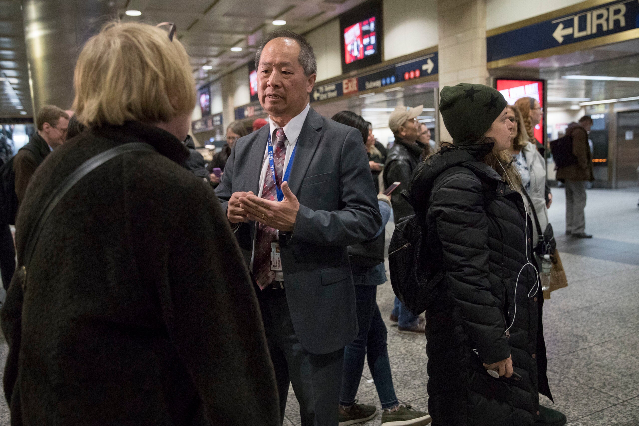 Then-Long Island Rail Road President Phillip Eng, center, talks to evening rush hour commuters at Penn Station in New York, April 17, 2018.