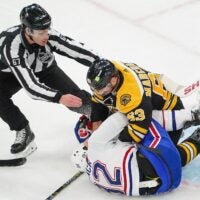 Brad Marchand takes issue with Montreal's Rem Pitlick.