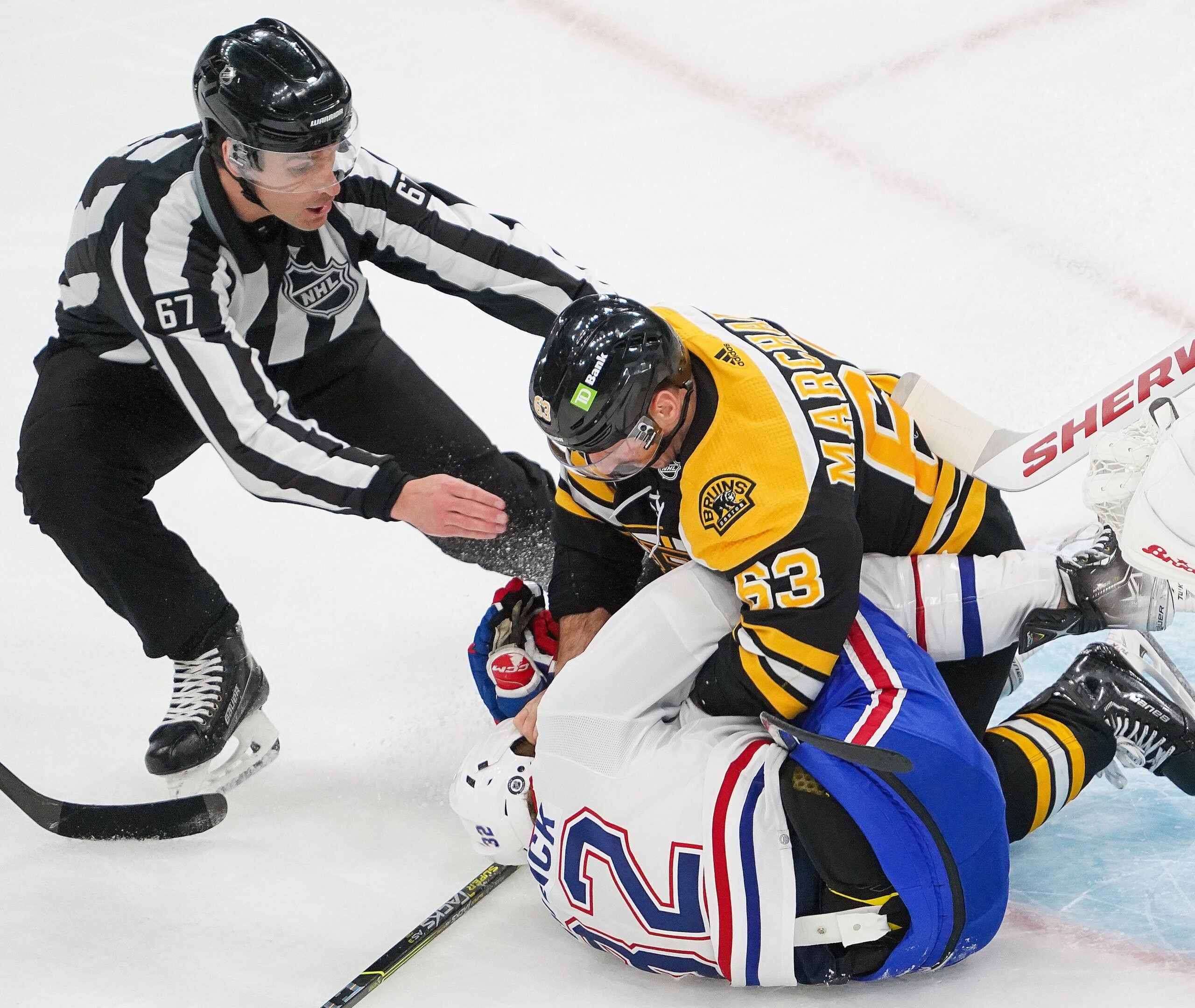 Brad Marchand takes issue with Montreal's Rem Pitlick.