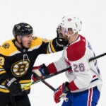 Bruins left wing Brad Marchand (63) fights with Montreal Canadiens defenseman Jeff Petry (26) during their game on Feb. 12, 2020 at TD Garden in Boston, MA.