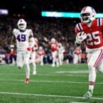 Marcus Jones #25 of the New England Patriots runs for a first quarter touchdown against the Buffalo Bills in the first half at Gillette Stadium on December 01, 2022 in Foxborough, Massachusetts.