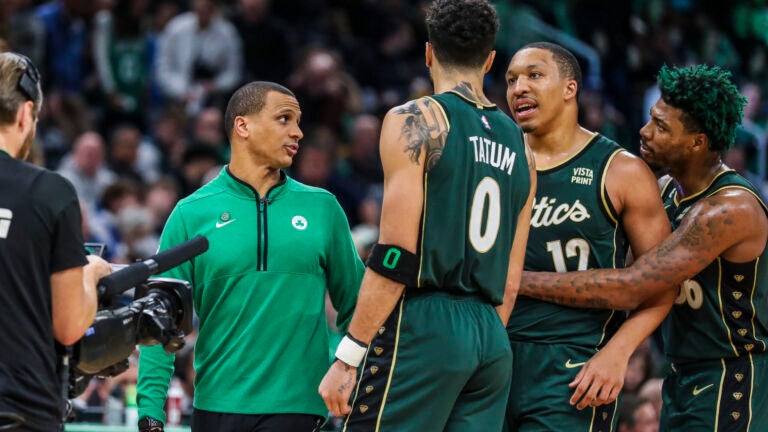 BOSTON, MA - 11/23/2022 Celtics Coach Joe Mazzulla talks to Boston Celtics forward Jayson Tatum (0), Boston Celtics forward Grant Williams (12) and Boston Celtics guard Marcus Smart (36) during a time out in the fourth quarter of Wednesday’s game at TD Garden.