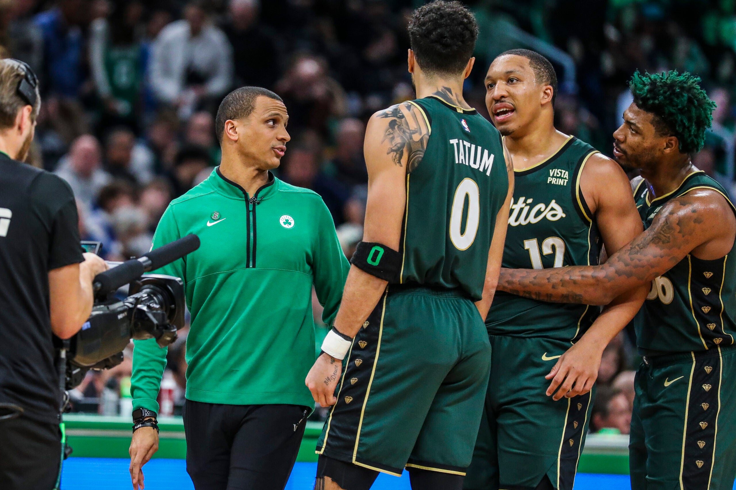 BOSTON, MA - 11/23/2022 Celtics Coach Joe Mazzulla talks to Boston Celtics forward Jayson Tatum (0), Boston Celtics forward Grant Williams (12) and Boston Celtics guard Marcus Smart (36) during a time out in the fourth quarter of Wednesday’s game at TD Garden.